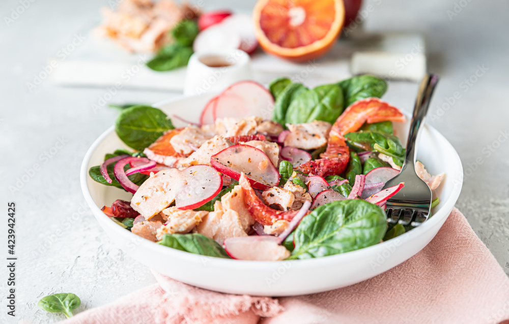 Salmon salad with orange, spinach and radish with ingredient for making salad on wooden cutting board. Healthy food. Salmon salad with orange, spinach and radish with ingredient for making salad on wooden cutting board. Healthy food.