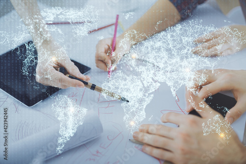 Double exposure of social network theme drawing and man and woman working together holding and using a mobile device.