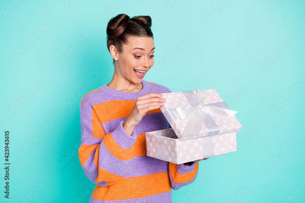 Photo of excited pretty funny lady look arms open giftbox open mouth unexpected isolated on blue color background Photo of excited pretty funny lady look arms open giftbox open mouth unexpected isolated on blue color background