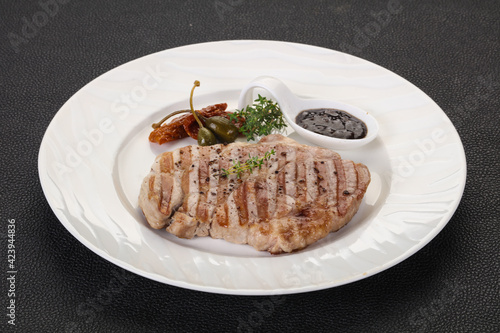 Grilled pork steak with pepper sauce