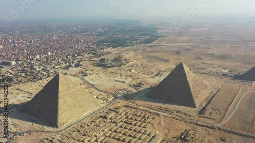 Aerial outward reveal shot of 3 pyramids in Giza, Egypt photo