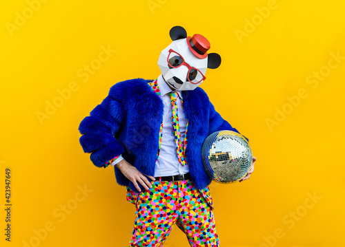 Man with funny low poly mask on colored background