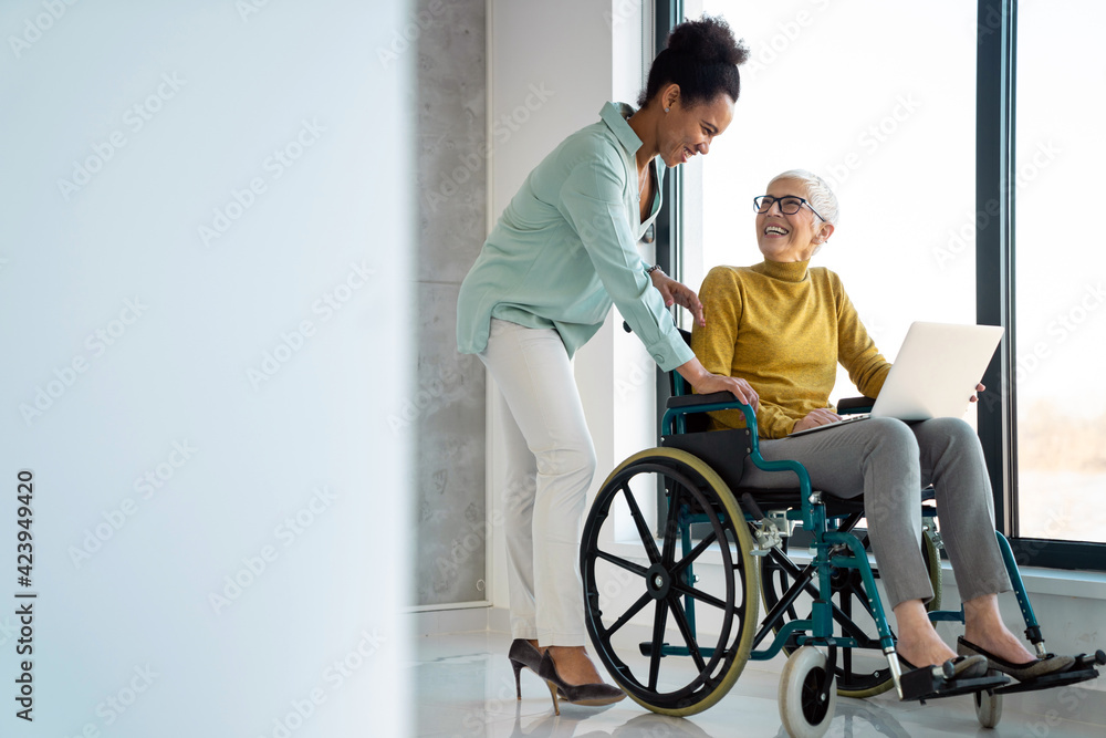 Business people with disabiliy working on new project together in office Business people with disabiliy working on new project together in office