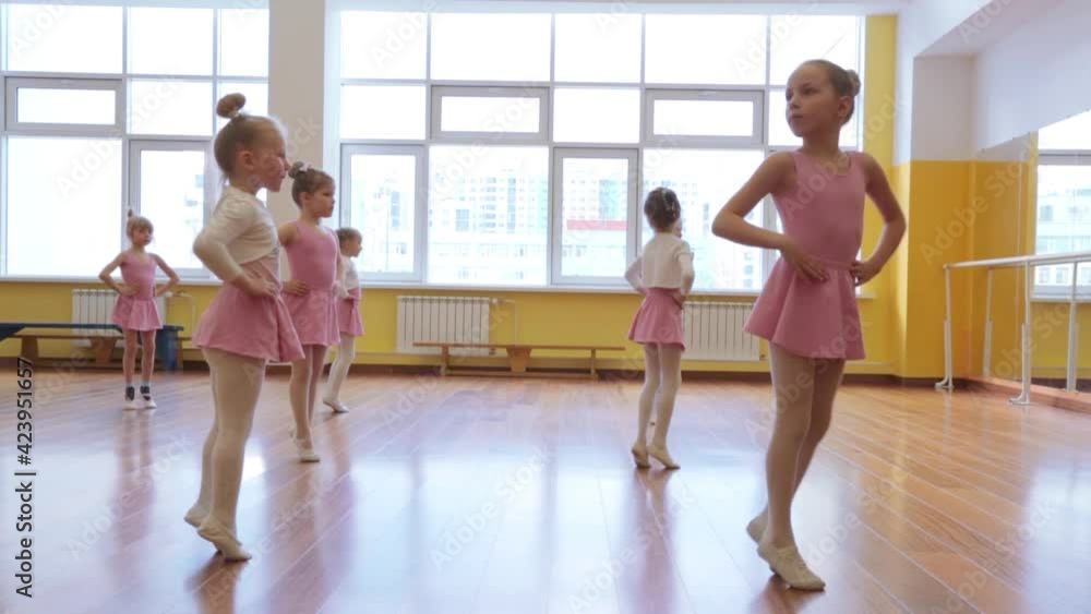 Group of little girls practicing in ballet school Group of little girls practicing in ballet school