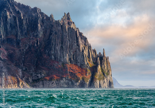 Majestic Arctic seascape. Picturesque sea and cliff views. Epic northern landscape with rocky seaside. Sea cruises to the Arctic. Cape Enmylyn  Eastern coast of Chukotka  Bering Sea  Far East Russia.