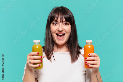 surprised expression and holding a soothy photo