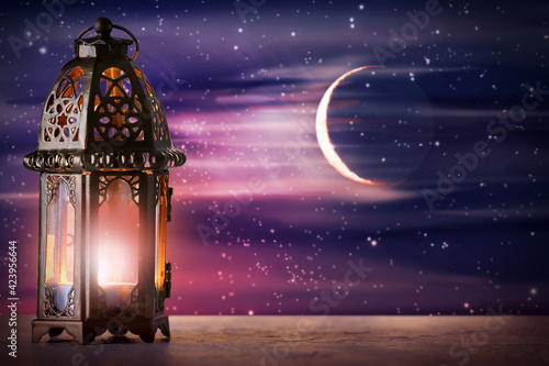 Muslim lamp on table agains...