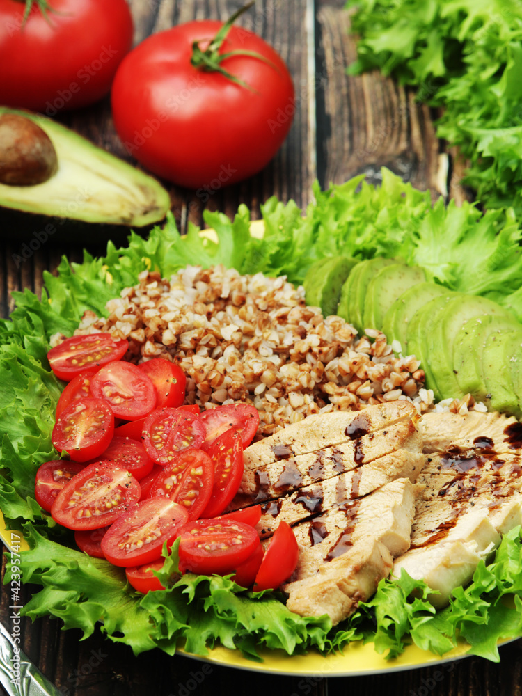 Turkey breast, avocado, salad and buckwheat as healthy lunch	