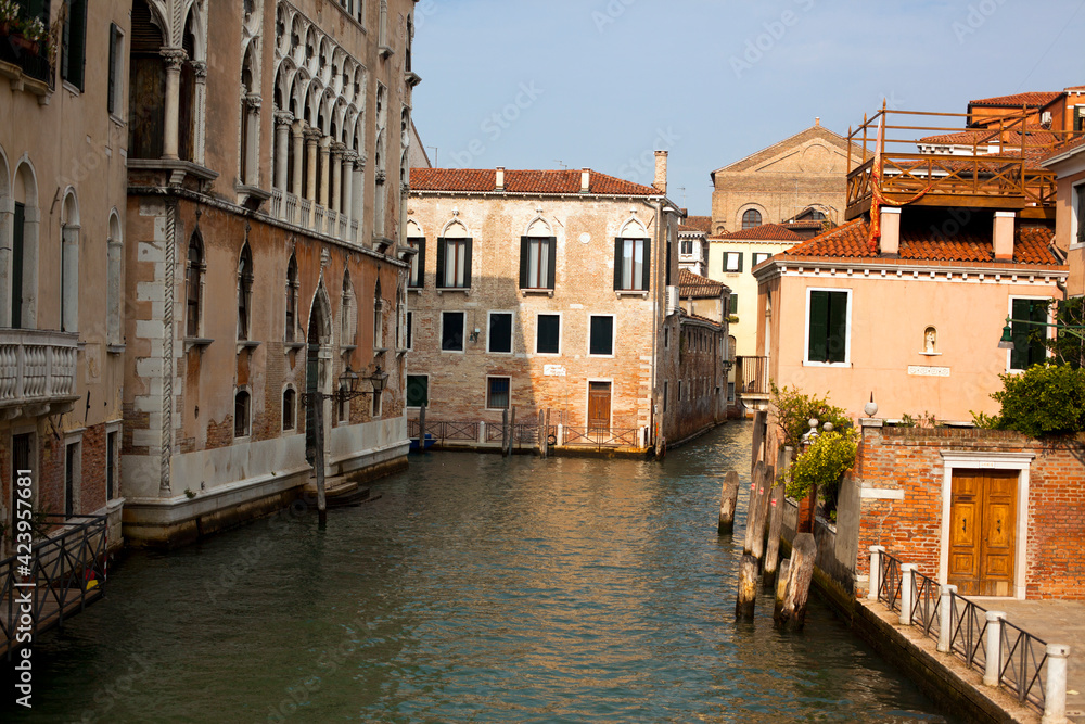 Sinking city Venice beautiful view on narrow beautiful canal with ancient buildings in Italy