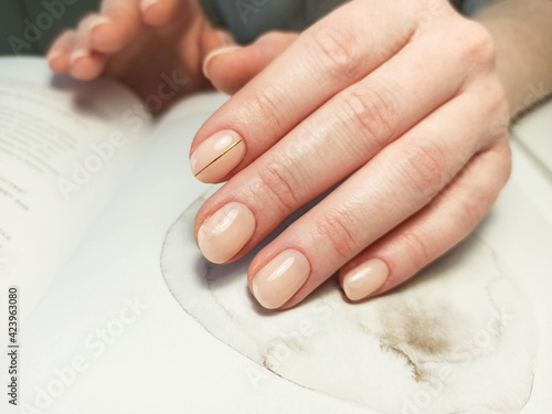 Female hands with nail design. Manicure and Hands Spa. . Beauty treatment. Beautiful woman's nails with beautiful baby boomer manicure copy space for. Manicured nails and Soft hands skin . Closeup