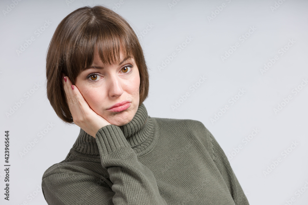 portrait of a disappointed looking young woman portrait of a disappointed looking young woman