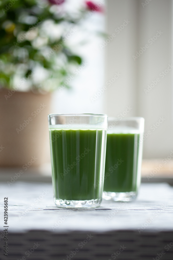 Pineapple, kiwi amd mint green smoothie on table. Pineapple, kiwi amd mint green smoothie on table.