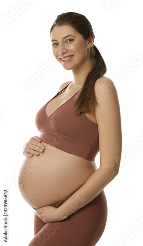 Happy young pregnant woman on white background