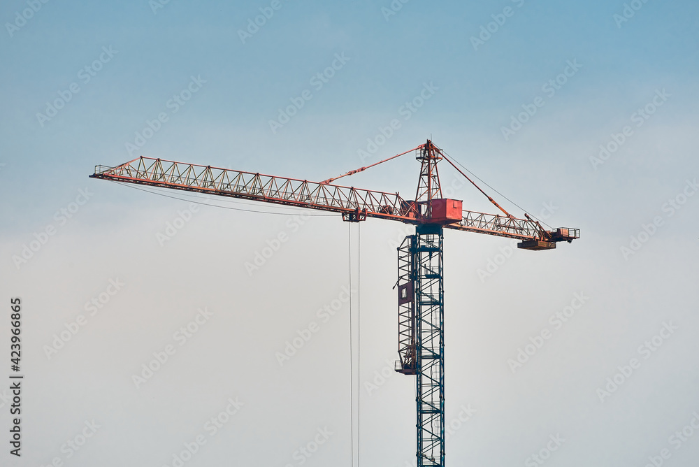 one big construction crane on blue sky background one big construction crane on blue sky background