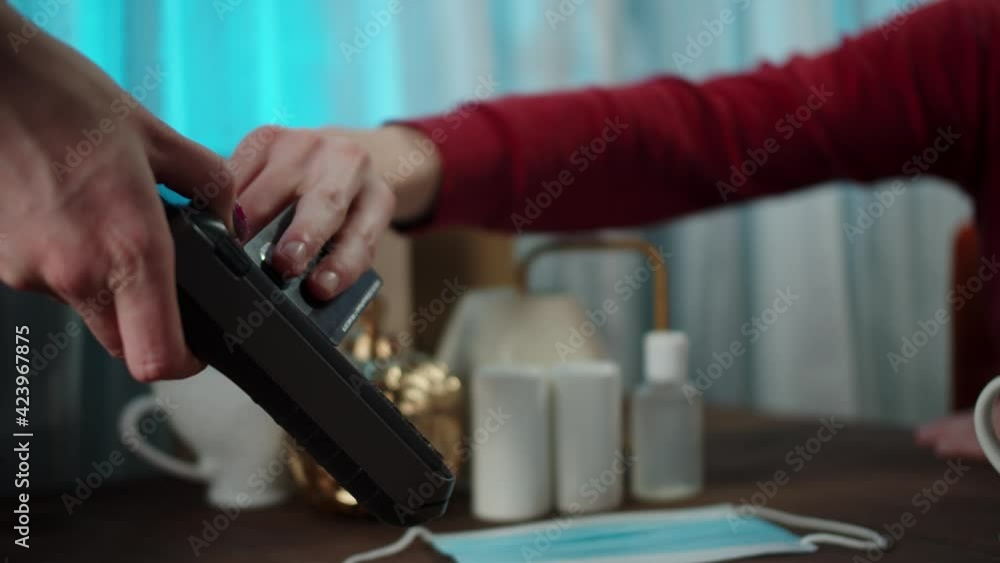 Using contactless payment to observe safety protection. Payment by credit card at the cafe. Paying the bill and entering the PIN code. Using contactless payment to observe safety protection. Payment by credit card at the cafe. Paying the bill and entering the PIN code.