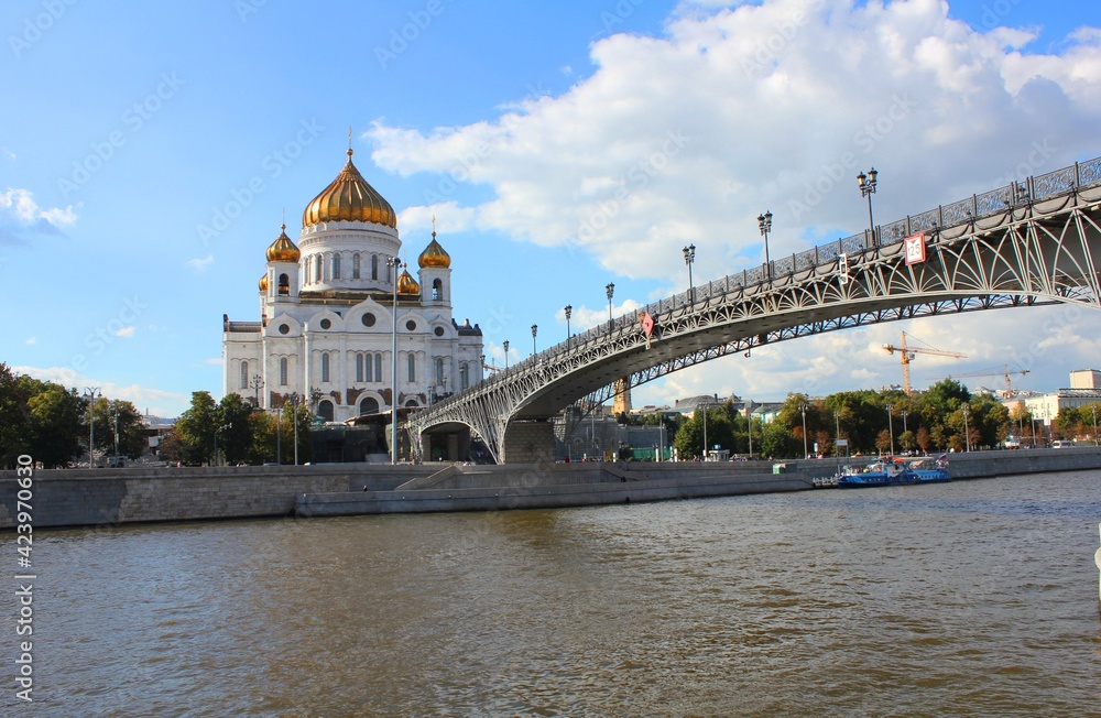 Cathedral of Christ the Savior in Moscow with a bridge over the Moscow river on a bright sunny day. 