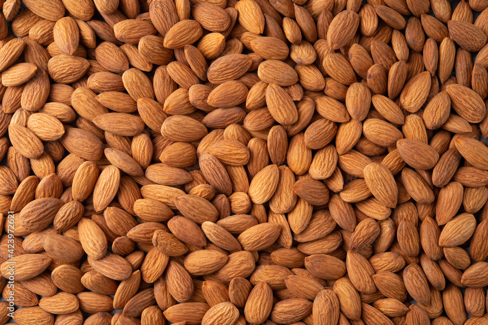Almonds. Almond background. Almonds top view background. Whole nuts flat lay. Full depth of field. Almonds. Almond background. Almonds top view background. Whole nuts flat lay. Full depth of field.