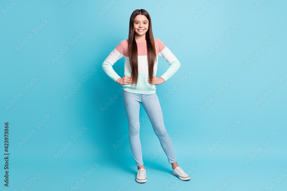Full body photo of young attractive schoolgirl happy positive smile isolated over blue color background Full body photo of young attractive schoolgirl happy positive smile isolated over blue color background