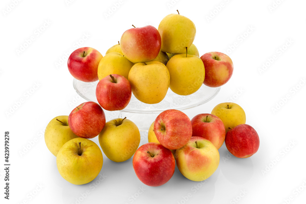 fuji apples and golden apples on clear glass raised plate, red and