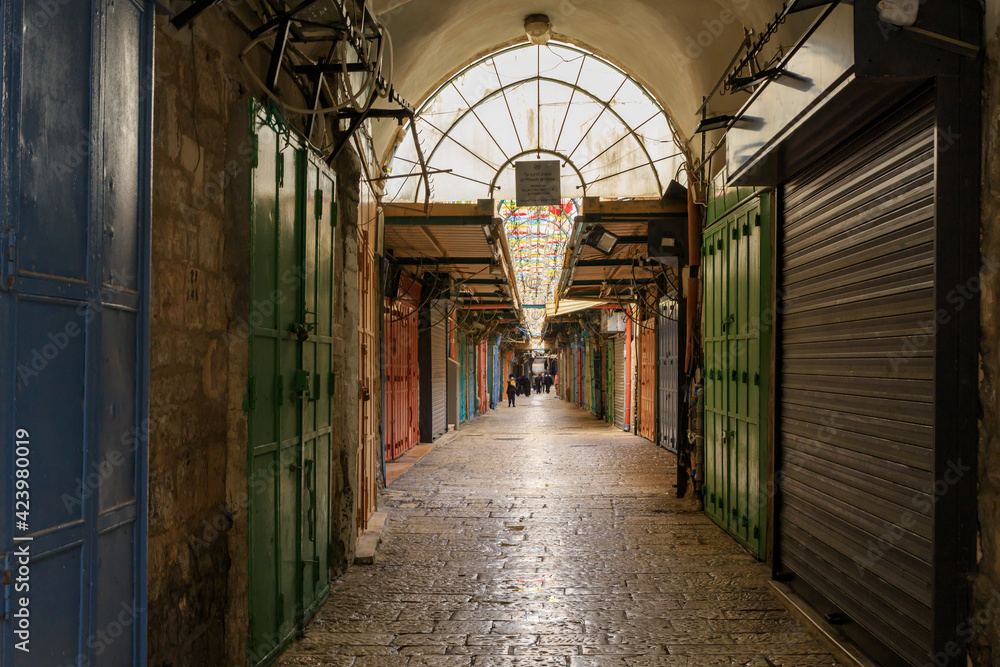 Closed shops on Daniel Street Arab market on a rainy day near the Yafo Gate in the old city of Jerusalem, in Israel