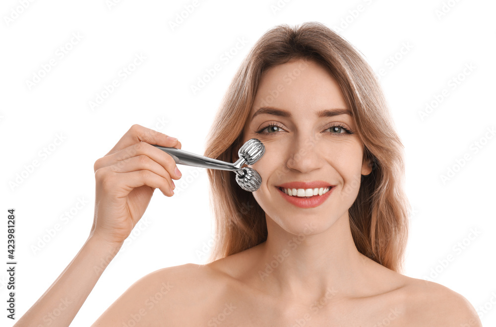 Young woman using metal face roller on white background Young woman using metal face roller on white background