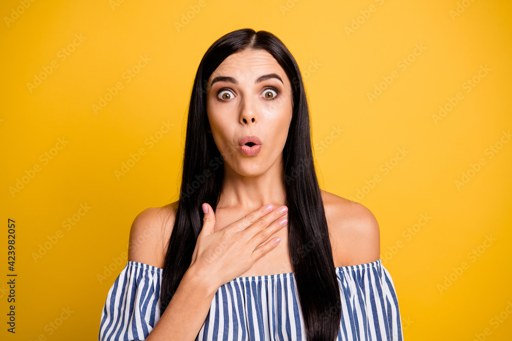 Photo of impressed upset young woman dressed off-shoulders dress big eyes arm isolated yellow color background Photo of impressed upset young woman dressed off-shoulders dress big eyes arm isolated yellow color background