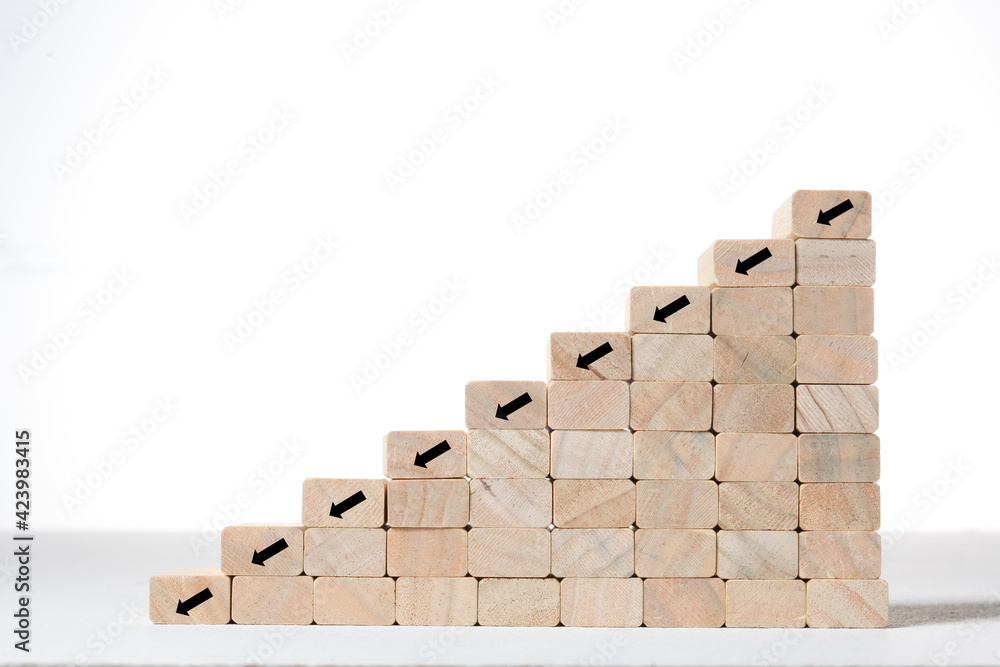 Fototapeta premium stairs and growth concept; toy wood blocks make a step stairs isolated on white background with copy space for your