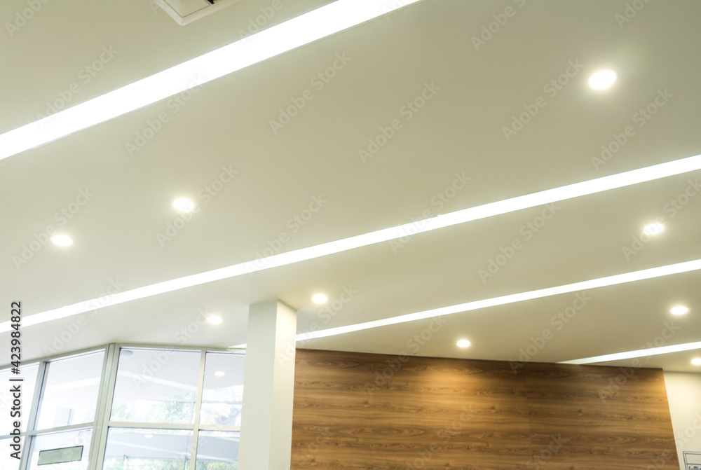 Lighting and ceiling mounted air conditioner on the modern office ceiling Lighting and ceiling mounted air conditioner on the modern office ceiling
