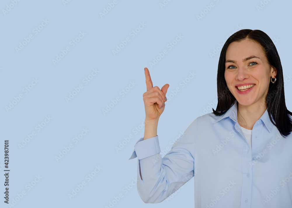 smiling woman in blue shirt showing ok sign against blue background smiling woman in blue shirt showing ok sign against blue background