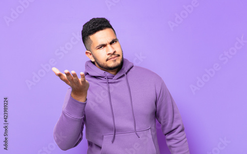 young hispanic athlete man angry expression photo