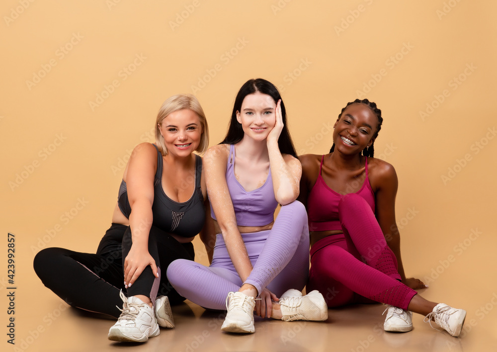 Portraif Of Three Different Smiling Multi Ethnic Ladies Posing In Sportswear Portraif Of Three Different Smiling Multi Ethnic Ladies Posing In Sportswear