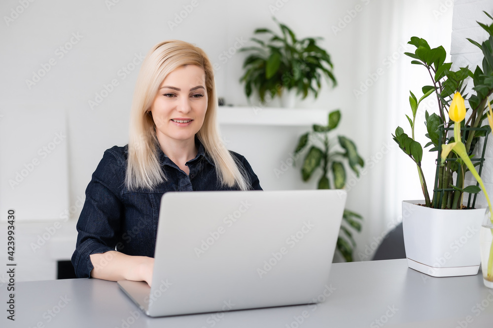 young beautiful woman using a laptop computer at home young beautiful woman using a laptop computer at home