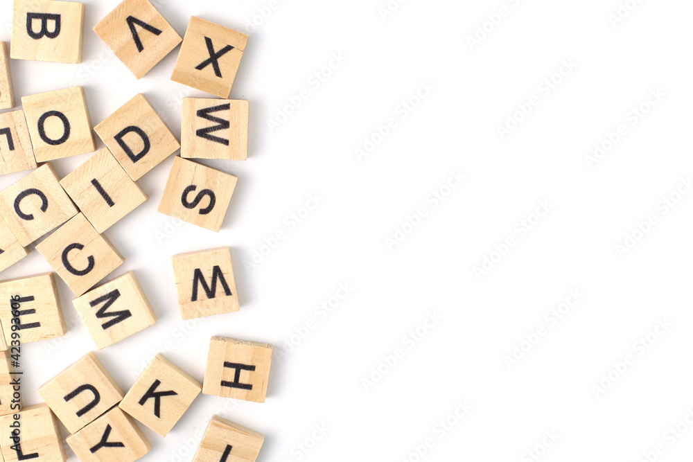 Top view the distribution of letters on wooden tiles scraped in a square shape Isolated on white background. with copy space Top view the distribution of letters on wooden tiles scraped in a square shape Isolated on white background. with copy space