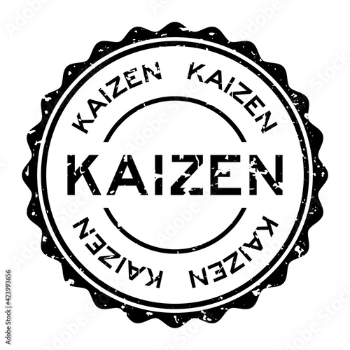 Grunge black kaizen word round rubber seal stamp on white background
