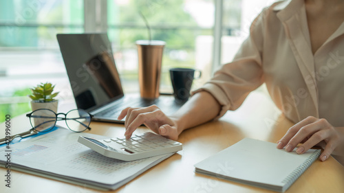 Billede på lærred Businesswoman calculating budget numbers, Invoices, and financial adviser working