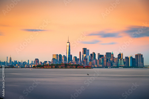 New York, New York, USA skyline from the harbor with Ellis Island