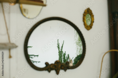 Large round mirror on a white wall