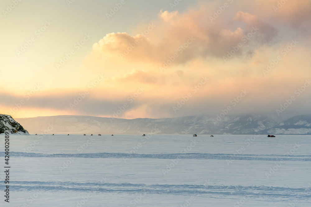 Cars crossing Baikal lake in winter Cars crossing Baikal lake in winter