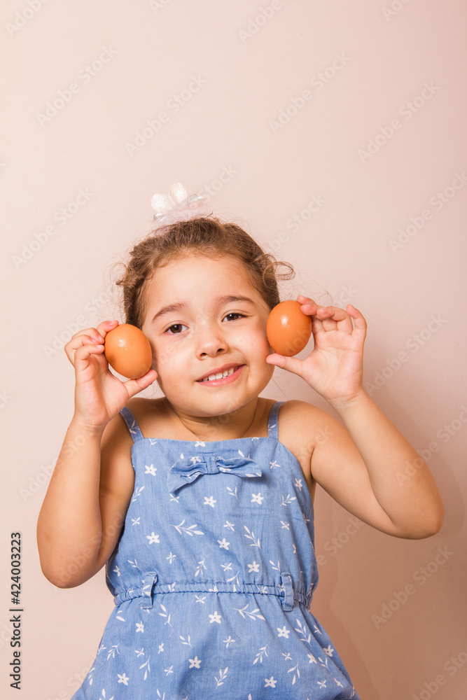 Smiling child holding two eggs. Smiling child holding two eggs.