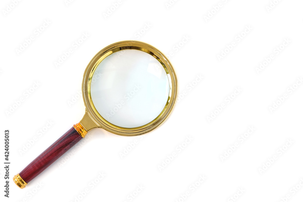 Gold plated magnifier with red handle on white background, isolate. Gold plated magnifier with red handle on white background, isolate.