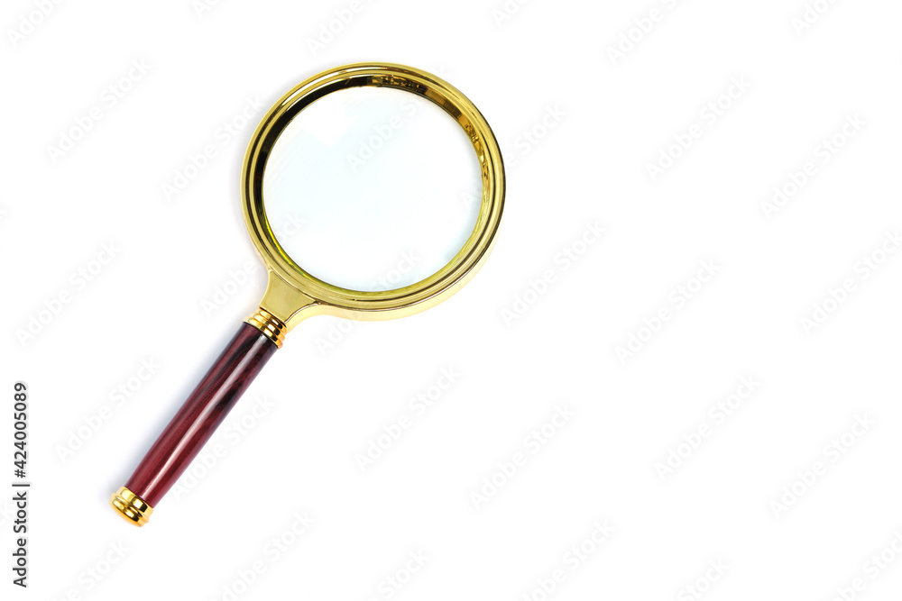 Gold plated magnifier with red handle on white background, isolate. Gold plated magnifier with red handle on white background, isolate.