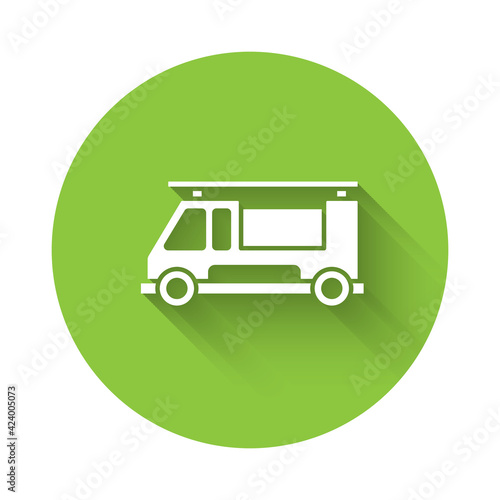 White Fire truck icon isolated with long shadow. Fire engine. Firefighters emergency vehicle. Green circle button. Vector