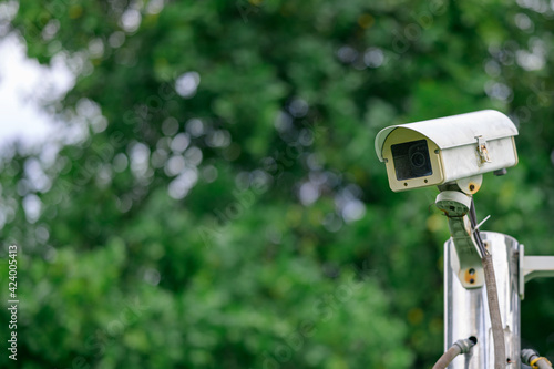IP CCTV camera or surveillance security camera with nature bokeh background