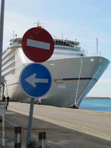 German luxury yacht cruiseship or cruise ship liner MS Europa 2 in port of Barcelona, Spain with view of harbor scenery and No Entry signage street signs photo