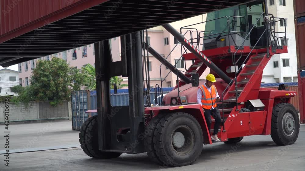 asian business woman supervisor walking and using clipboard checking list inventory loading Containers box discussion with foreman driver on forklift at warehouse logistic in Cargo freight ship . asian business woman supervisor walking and using clipboard checking list inventory loading Containers box discussion with foreman driver on forklift at warehouse logistic in Cargo freight ship .