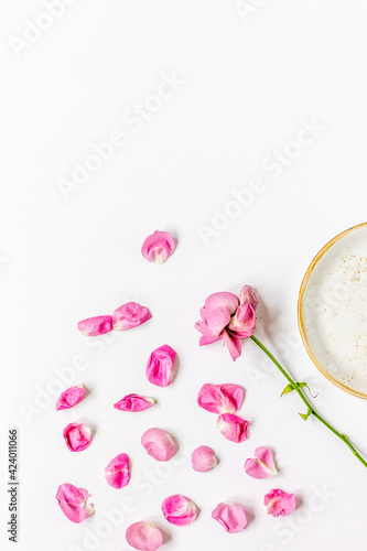 woman table with rose flower top view white background space for text