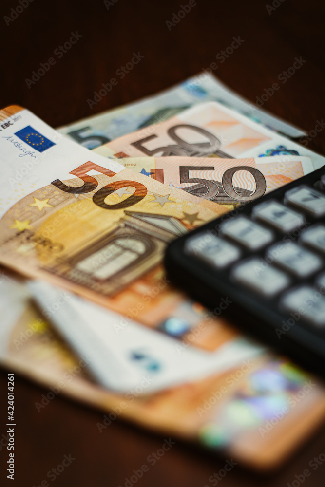 50 Euro bills with a calculator