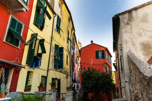 Porto Venere,Liguria,Italy. June 2020.Typical secondary alley in the heart of the town: they are called carruggio. Houses with colorful facades and pots with ornamental plants lend a distinctive charm