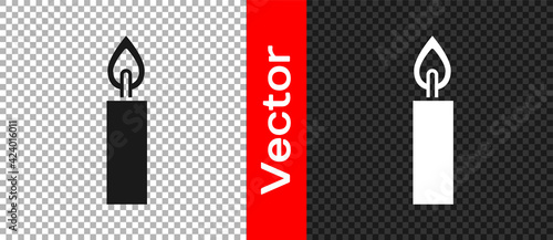 Black Burning candle icon isolated on transparent background. Cylindrical candle stick with burning flame. Vector