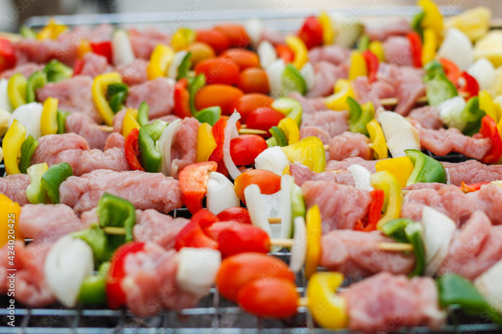 Blurred image,Barbecue (BBQ) skewered on a charcoal grill is a street food that is convenient for a party or picnic and barbecue (BBQ) is also increasing its popularity in many countries. Blurred image,Barbecue (BBQ) skewered on a charcoal grill is a street food that is convenient for a party or picnic and barbecue (BBQ) is also increasing its popularity in many countries.